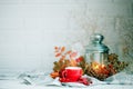 Cup of coffee, cones, berries and autumn leaves on a wooden table. Autumn background. Royalty Free Stock Photo