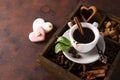 Cup of coffee with cooffee beans on a wooden box with grains of coffee and spices on a stone background Royalty Free Stock Photo