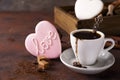 Cup of coffee with cooffee beans, wooden box with grains of coffee and spices, cookies on a stone background Royalty Free Stock Photo