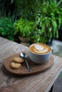 Cup of coffee and cookie in coffee shop vintage color Royalty Free Stock Photo