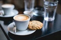cup of coffee and cookie on a table Royalty Free Stock Photo