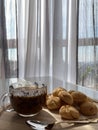 Cup of coffee with cookies near window Royalty Free Stock Photo