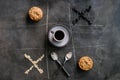 Cup of coffee, cookies, pair of spoons, oatmeal, raisins in the composition and form of tic-tac-toe game on stone