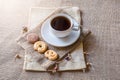 Cup of coffee and cookies on sackbag Royalty Free Stock Photo