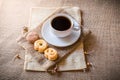 Cup of coffee and cookies on sackbag Royalty Free Stock Photo