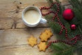 Cup of coffee with cookies in star shape and fir branches with c Royalty Free Stock Photo