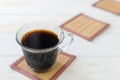 Cup of coffee with cookies. on white wooden board.