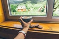 Cup of coffee with cookies on windowsill