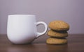 Cup of coffee and cookies on wooden table Royalty Free Stock Photo