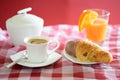 Cup of coffee, croissant, orange juice and a sugar bowl Royalty Free Stock Photo