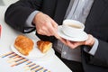 Cup of coffee and croissant at work Royalty Free Stock Photo