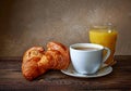 Cup of coffee, croissants and orange juice Royalty Free Stock Photo