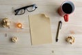 Cup of coffee and crumpled paper with blank paper on desk, Royalty Free Stock Photo