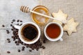Cup of coffee, cup of tea and bowl of honey Royalty Free Stock Photo