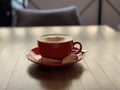 Cup of coffee cuppuccino on wooden table Royalty Free Stock Photo