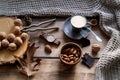 Cup of coffee, different kinds of nuts, walnut, hazelnuts, almonds on old wooden table boards, edible seed kernels, food concept, Royalty Free Stock Photo