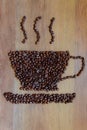 A cup of coffee drawn using coffee beans