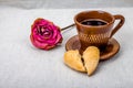 Cup of coffee, dried rose, broken heart cookies