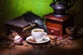 Cup of coffee, dry rose and grinder Royalty Free Stock Photo