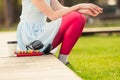 Cup of coffee, earphones, books and female in close-up Royalty Free Stock Photo