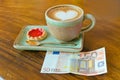 Cup of coffee and euro note Royalty Free Stock Photo
