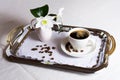 Cup of coffee on exquisite embroidered napkin Royalty Free Stock Photo
