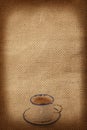 Cup of coffee on fabric background