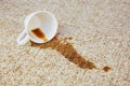 Cup of coffee fell on carpet. Royalty Free Stock Photo