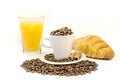 Cup of coffee filed with coffee beans with croissants, two cinnamon stick Royalty Free Stock Photo