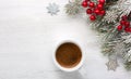 Cup of coffee and fir branch with Christmas decorations on old wooden shabby background with empty space for text. Top view Royalty Free Stock Photo