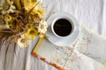 Cup of coffee, flower pot and map on table