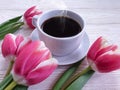 Cup of coffee flower tulip design greeting wooden background holiday