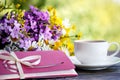 Cup of coffee, flowers and an envelope Royalty Free Stock Photo