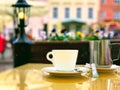 Cup of coffee  and flowers on table top in street cafe in summer Tallinn old town people lifestyle travel to Europe Royalty Free Stock Photo