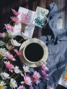 A cup of coffee and flowers