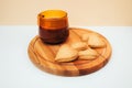 A cup of coffee with foam and a plate with heart-shaped shortbread cookies on a white table Royalty Free Stock Photo