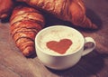 Cup of coffee with french croissant Royalty Free Stock Photo