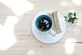 Cup of coffee, fresh tuna sandwich and white flowers on wood background Royalty Free Stock Photo