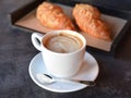 Cup of coffee with freshly baked croissants Royalty Free Stock Photo