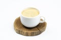 A cup of coffee. Frothy coffee. White cup. On white background.