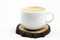 A cup of coffee. Frothy coffee. White cup. On white background.