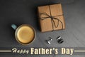 Cup of coffee, gift box and cuff links on table, flat lay. Happy father`s day Royalty Free Stock Photo