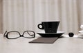 Cup of coffee, glasses, cherry