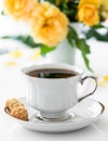 Cup of coffee. Good morning. Yellow flowers