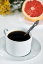Cup of coffee and grapefruit Royalty Free Stock Photo