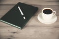 cup of coffee and green notepad Royalty Free Stock Photo