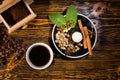 Cup of Coffee with Grinder and Plate of Garnishes Royalty Free Stock Photo