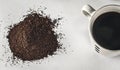Cup of coffee and ground coffee Royalty Free Stock Photo