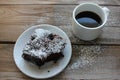 Cup Of Coffee With Handmade Chocolate Cake On Wooden Table Background. Brownie With Cherries On A White Plate.