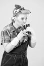 Cup of coffee in hands of girl with blonde curls. Pin-up style